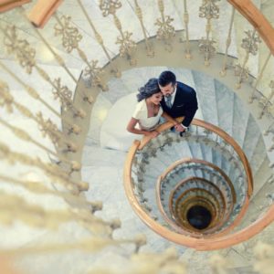 Just married couple in a spiral staircase